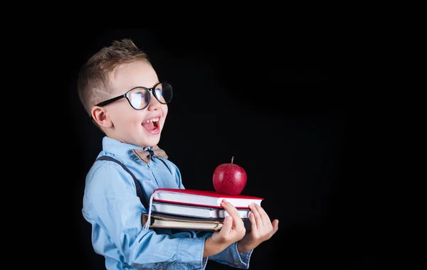 Cheerful smiling little boy on a black background. Looking at camera. School concept — Stock Photo, Image