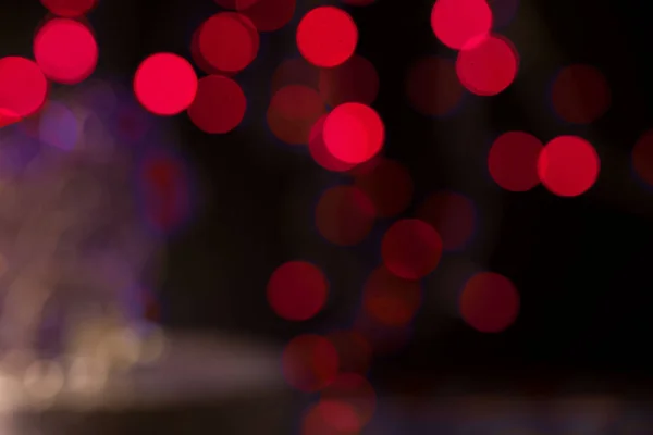 Luces de Navidad abstractas como color rojo de fondo . —  Fotos de Stock