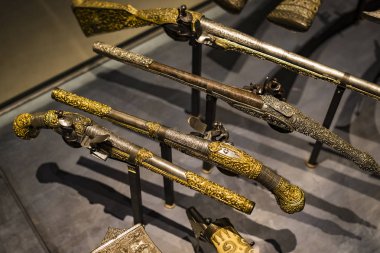 4 JUNE 2018, MILAN, ITALY: Museum of the Poldis Pezzoli Knights' Hall with samples of medieval weapons and ammunition clipart