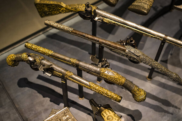 4 JUNE 2018, MILAN, ITALY: Museum of the Poldis Pezzoli Knights' Hall with samples of medieval weapons and ammunition