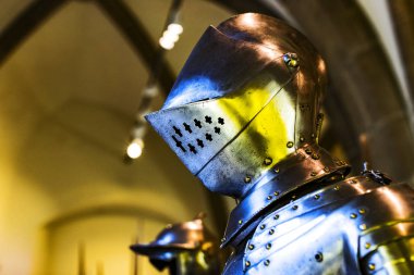 MUNICH, GERMANY - NOVEMBER 27, 2018 : The exposition of medieval armor and knight knights presented in the Bavarian National Museum in Munich.  clipart