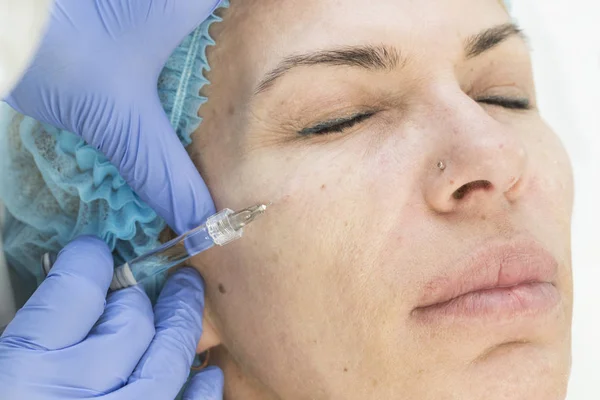 Cosmetic surgery, medicine procedure for an adult woman in a cosmetology clinic.