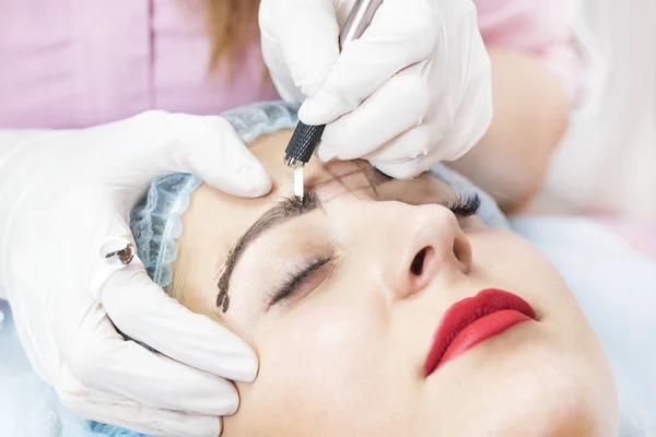 Microblading eyebrows workflow female eyebrowsin a beauty salon