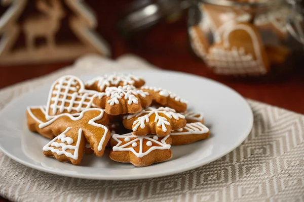 Christmas table with plate full of gingerbreads, homemade biscuits — Stock Photo, Image