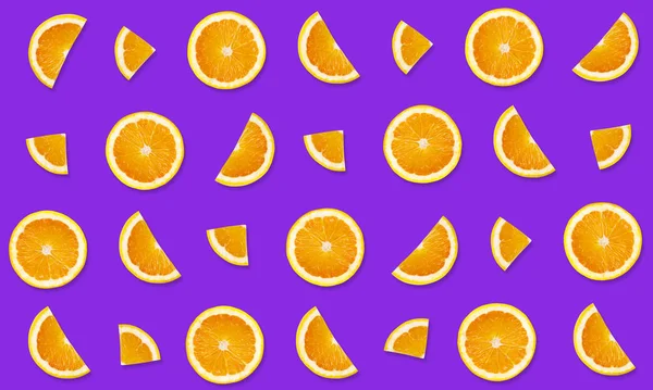 Fruit pattern from slices of orange on purple background — Stock Photo, Image