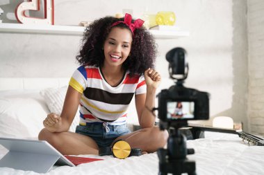 Girl Recording Vlog Video Blog At Home With Camera clipart