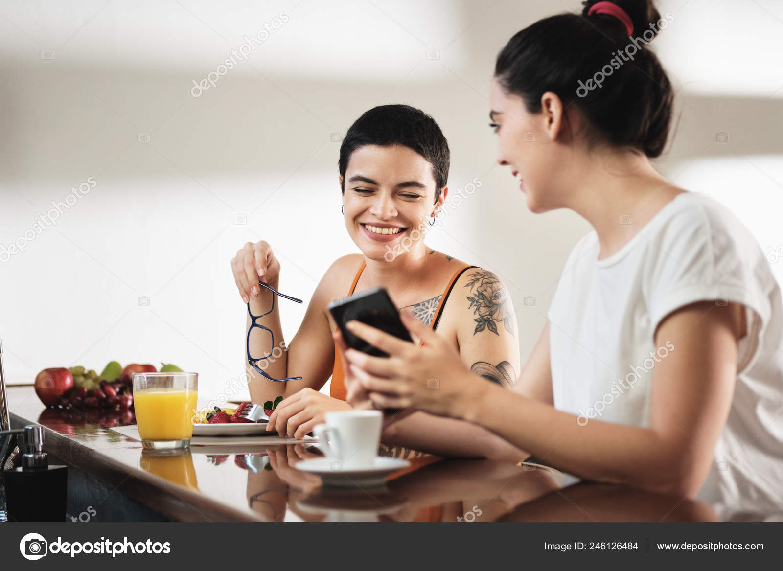 Same Sex Lgbt Partners Eating Breakfast And Watching Videos Stock Photo by ©diego_cervo 246126484