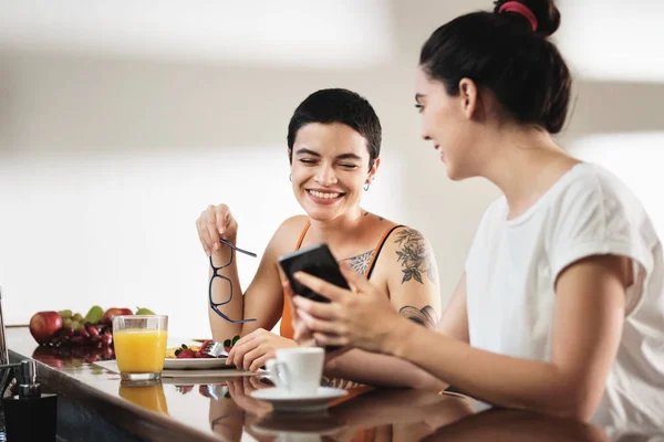 Same Sex Lgbt Partners Eating Breakfast And Watching Videos — Stock Photo, Image