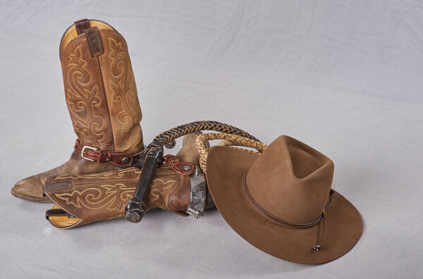 cowboy boots, spurts, bull whip, cowboy sombreo