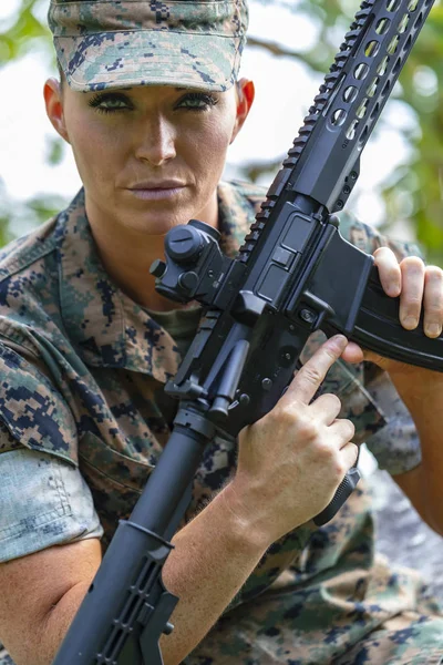 A female military Marine posing in a military uniform