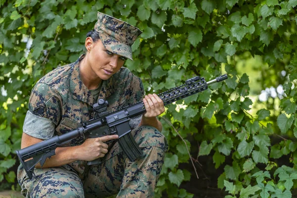 A female military Marine posing in a military uniform