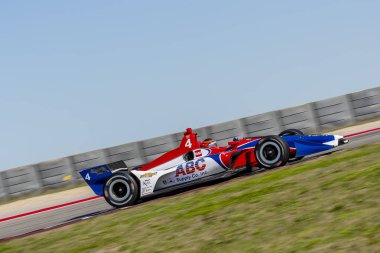 Matheus Leist (4) Brezilya uygulamaları sırasında döner devre Of Americas Austin, Teksas, IndyCar bahar Test için geçer.