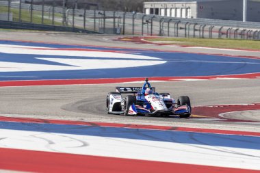 Devre Of Americas Austin, Teksas, IndyCar bahar Test için döner uygulamaları sırasında Graham Rahal (15) Amerika Birleşik Devletleri'nin geçer.