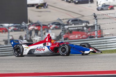 Matheus Leist (4) Brezilya uygulamaları sırasında döner devre Of Americas Austin, Teksas, IndyCar bahar Test için geçer.