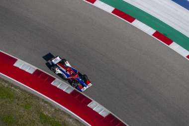 Matheus Leist (4) Brezilya uygulamaları sırasında döner devre Of Americas Austin, Teksas, IndyCar bahar Test için geçer.