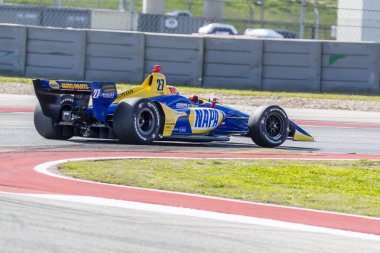 Alexander Rossi (27) Amerika Birleşik Devletleri'nin uygulamaları sırasında döner devre Of Americas Austin, Teksas, IndyCar bahar Test için geçer.