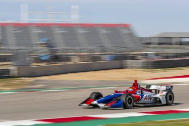 Matheus Leist (4) Brezilya uygulamaları sırasında döner devre Of Americas Austin, Teksas, IndyCar bahar Test için geçer.
