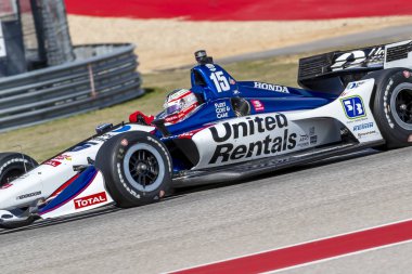 Devre Of Americas Austin, Teksas, IndyCar bahar Test için döner uygulamaları sırasında Graham Rahal (15) Amerika Birleşik Devletleri'nin geçer.