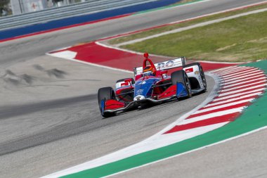 Matheus Leist (4) Brezilya uygulamaları sırasında döner devre Of Americas Austin, Teksas, IndyCar bahar Test için geçer.