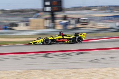 Sebastien Bourdais (18) Fransa'nın uygulamaları sırasında döner devre Of Americas Austin, Teksas, IndyCar bahar Test için geçer.