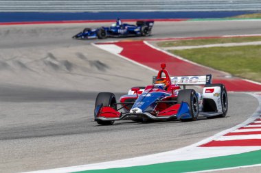 Matheus Leist (4) Brezilya uygulamaları sırasında döner devre Of Americas Austin, Teksas, IndyCar bahar Test için geçer.