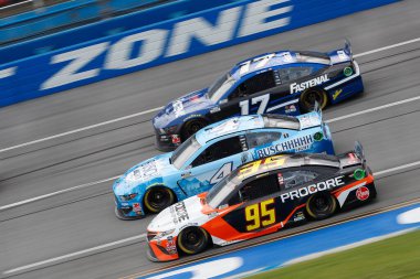 Christopher Bell (95) races down the dogleg during the GEICO 500 at Talladega Superspeedway in Lincoln, Alabama. clipart