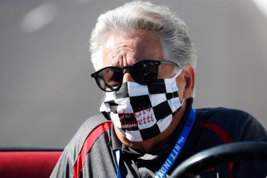 Legend, Mario Andretti, talks to drivers before Carb Day for the Indianapolis 500 in Indianapolis, Indiana. clipart