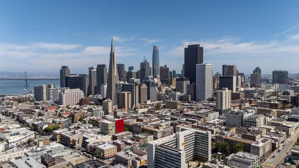 SAN FRANCISCO, CA USA - July 28, 2025:  An aerial view of San Francisco reveals a vibrant cityscape of rolling hills, diverse architecture, and iconic landmarks nestled along the edge of the Pacific coast.