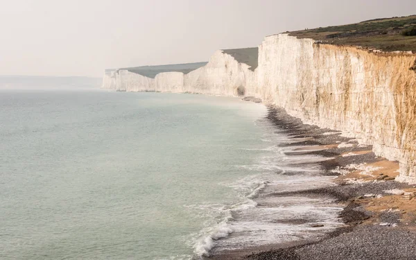 Seven Sisters chalk cliffs, Sussex, UK. A view along the white chalk cliffs on the south English coastline known as The Seven Sisters.