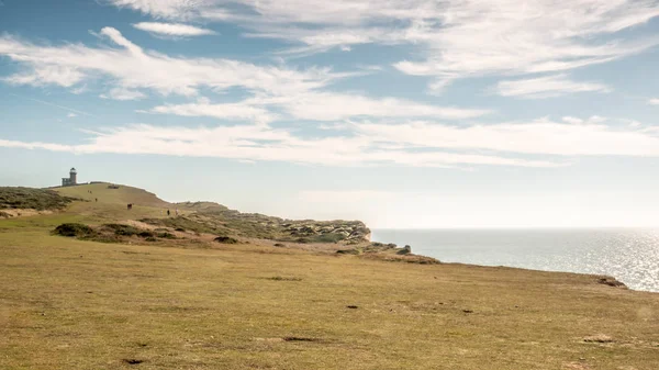 Belle Tout lighthouse, The South Downs and The English Channel. A view over the South Downs with the Belle Tout lighthouse looking out over the English Channel on the East Sussex coastline.