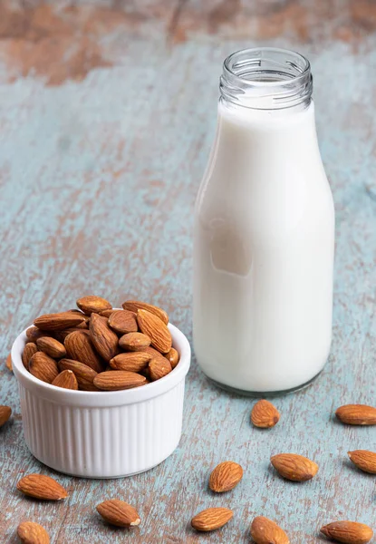 Close Up glass of Almond milk with Almond seeds. Almond milk in a glass with almonds