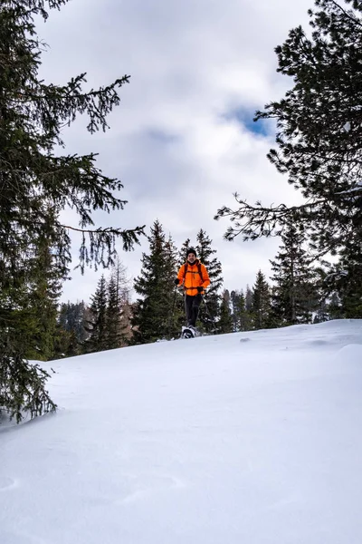 Man Orange Jacket Snowshoeing Snow Covered Scheibelalm Holiday Resort Hohentauern — Stock Photo, Image
