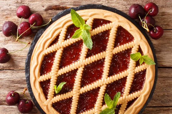 Italian crostata with cherries and mint cake close-up. horizonta — Stock Photo, Image