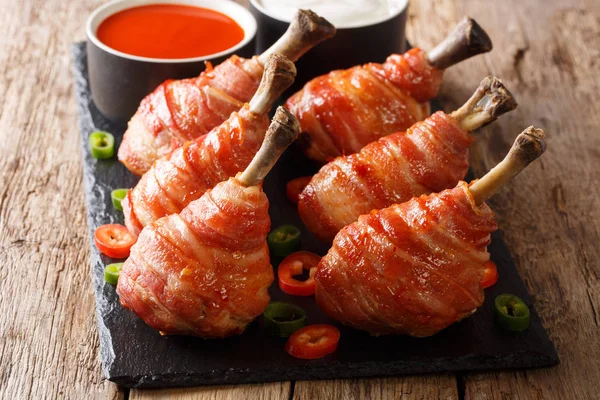 Recipe Lollipops Grilled Chicken Legs Wrapped Bacon Sauces Close Slate — Stock Photo, Image
