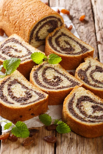 Freshly Baked Poppy Roll Raisins Decorated Mint Close Wooden Table — Stock Photo, Image