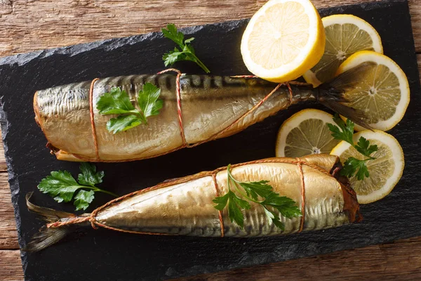 Delicious Whole Smoked Mackerel Lemons Parsley Closeup Black Slate Board — Stock Photo, Image