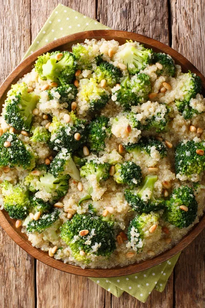 Vegetarian broccoli meal with quinoa and pine nuts closeup on a — Stock Photo, Image