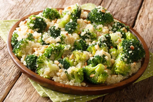 Homemade broccoli salad with quinoa and pine nuts closeup on the — Stock Photo, Image