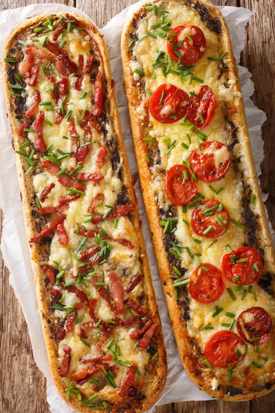 Close-up pizza sandwiches with bacon, mushrooms, tomatoes and ch