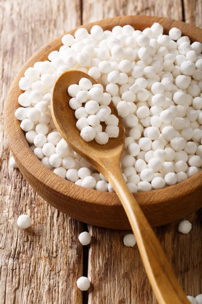 Dry pearl tapioca ingredient for cooking closeup in a bowl on a — Stock Photo, Image