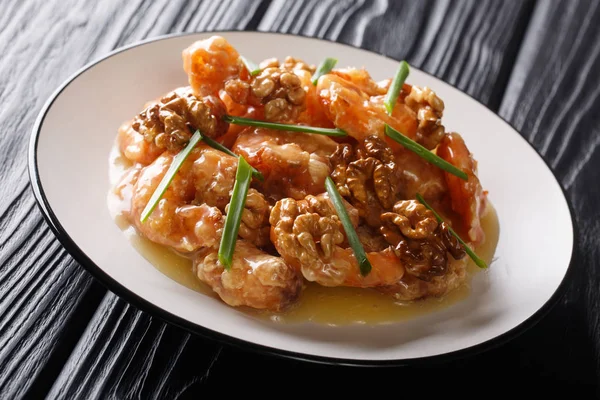 Chinese crispy shrimp tossed in a creamy, sweet sauce topped wit