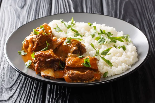 Slowly cooked short ribs in a spicy sauce with rice side dish cl — Stock Photo, Image