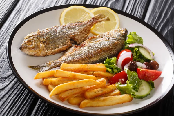 Traditional fried Sarpa salpa fish with lemon and side dish of f — Stock Photo, Image