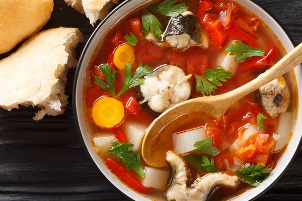 Vegetable soup with eel fish and tomatoes closeup in a bowl. Hor — Stock Photo, Image