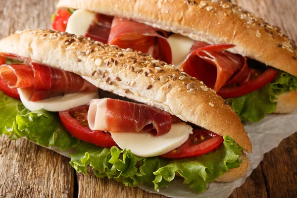 Delicious Italian sandwiches with prosciutto ham, mozzarella che — Stock Photo, Image