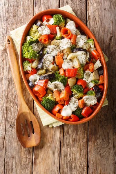 Healthy baked vegetables with mozzarella cheese close-up in a ba — Stock Photo, Image