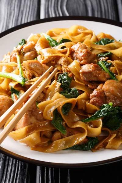 Thai Pad See Ew noodles with chicken, Chinese broccoli and egg c — стокове фото