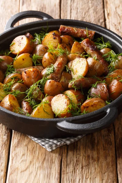 Fried New Potatoes Sausages Dill Close Pan Table Vertica — Stock Photo, Image