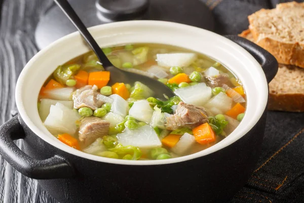 Hairst bree Lamb and summer vegetable soup close-up in a pot on the table. Horizonta — Stock Image Hairst Bree Lamb Summer Vegetable Soup Close Pot Table Horizonta Stock Image