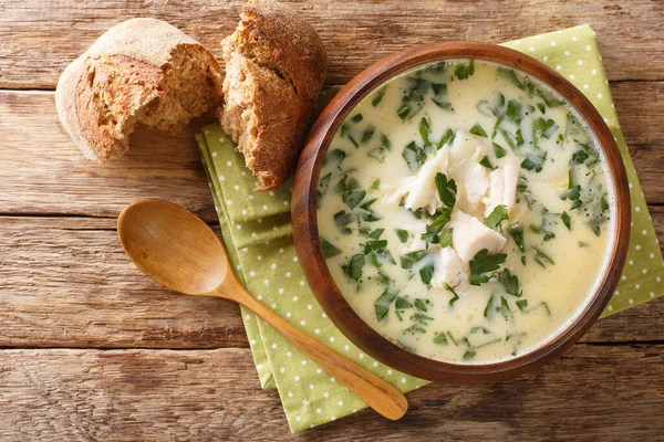 Homemade scotch milk soup cullen skink with smoked haddock and potatoes close-up in a bowl on the table. Horizontal top view from abov — Stock Image Homemade Scotch Milk Soup Cullen Skink Smoked Haddock Potatoes Close Royalty Free Stock Photos